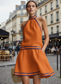 Side view of the halter mini dress showing the flattering mini length