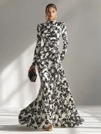 Model wearing the abstract floral mermaid maxi dress in Red