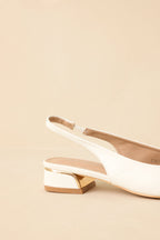 White pointed-toe slingback block heels - top view