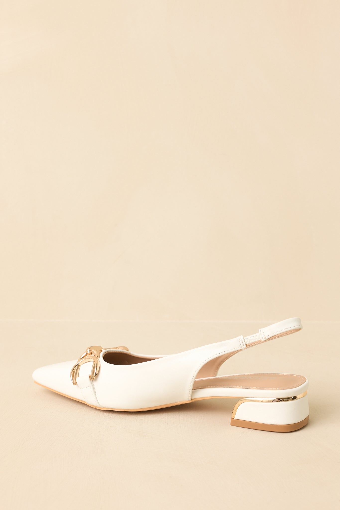 White pointed-toe slingback block heels - sole view