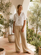 Model in wrap-neck blouse
