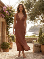 Model wearing the sleeveless deep V-neck linen maxi dress in a breezy summer setting