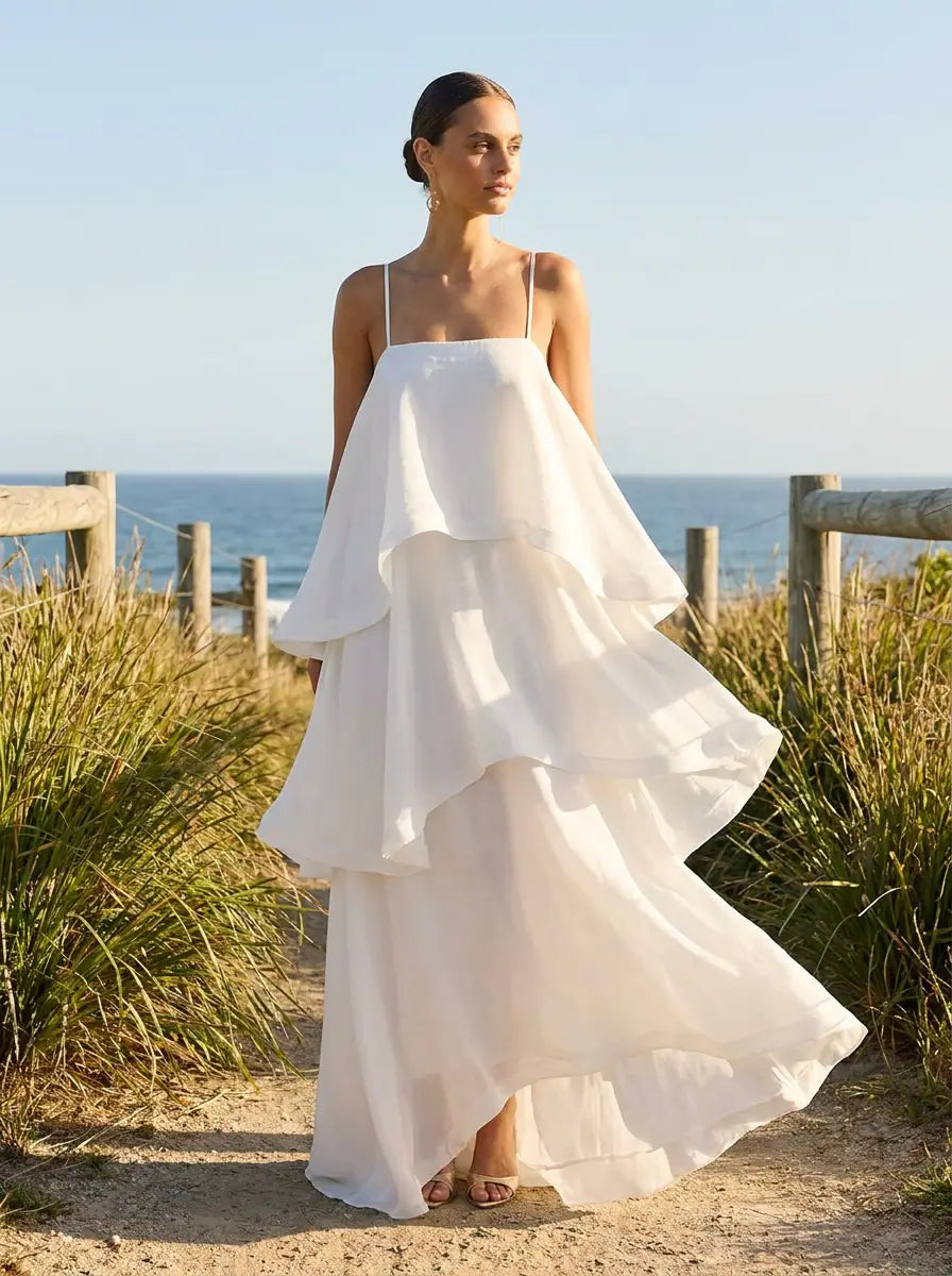 Model wearing the tiered flared maxi dress with adjustable straps