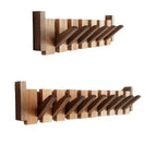 Wooden piano-shaped coat rack detail view